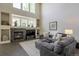 Comfortable living room with a fireplace, high ceilings, built-in shelving, and stylish decor at 3754 Broadview Pl, Castle Rock, CO 80109