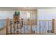 Elegant staircase featuring oak and wrought iron railings, leading to the upper levels of the home at 3754 Broadview Pl, Castle Rock, CO 80109