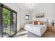 Cozy bedroom with plush carpet, neutral tones, and balcony access for a serene retreat at 485 E Arizona Ave, Denver, CO 80210