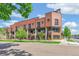 Charming brick townhomes with well-manicured landscaping and street parking at 485 E Arizona Ave, Denver, CO 80210