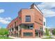 Stunning brick building featuring modern architectural details, balconies, and convenient awnings at 485 E Arizona Ave, Denver, CO 80210
