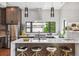 Modern kitchen with stainless steel appliances, white countertops, and stylish bar stool seating at 485 E Arizona Ave, Denver, CO 80210