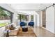 Bright living room featuring polished floors, oversized windows and comfortable seating at 485 E Arizona Ave, Denver, CO 80210