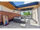 Relaxing rooftop patio with outdoor seating, string lights, and beautiful brick accents at 485 E Arizona Ave, Denver, CO 80210