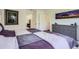 Inviting bedroom with a queen bed, dresser, and decor art at 7022 Todd Ct, Frederick, CO 80530