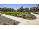 Inviting community space with manicured lawn, mature trees, and pet-friendly amenities at 7022 Todd Ct, Frederick, CO 80530