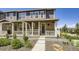 Charming two-story townhome with a stone facade and a welcoming covered porch at 7022 Todd Ct, Frederick, CO 80530