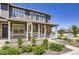 Charming front porch with stone accents, rocking chairs, and tasteful landscaping at 7022 Todd Ct, Frederick, CO 80530