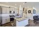 Modern kitchen featuring granite countertops, stainless steel appliances, and stylish cabinetry at 7022 Todd Ct, Frederick, CO 80530