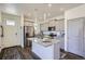 Bright kitchen with stainless steel appliances, granite countertops, and a functional island at 7022 Todd Ct, Frederick, CO 80530