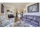 Bright living room featuring modern decor, hardwood floors, and ample natural light at 7022 Todd Ct, Frederick, CO 80530