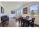 Bright and airy living and dining space with hardwood floors and large windows at 7022 Todd Ct, Frederick, CO 80530