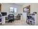 Functional home office space with built-in desk, organized shelves, and natural light at 7022 Todd Ct, Frederick, CO 80530
