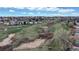 Expansive green space with a walking path weaving through the landscape, offering recreational opportunities and a scenic view at 464 Chiswick Cir, Highlands Ranch, CO 80126