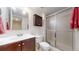 Functional bathroom with a shower and dark wood cabinets at 464 Chiswick Cir, Highlands Ranch, CO 80126