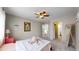 Comfortable bedroom with soft carpet, a ceiling fan, and easy access to a bathroom at 464 Chiswick Cir, Highlands Ranch, CO 80126
