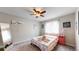Cozy bedroom with plush carpeting, a ceiling fan, and natural lighting at 464 Chiswick Cir, Highlands Ranch, CO 80126