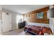 This cozy bedroom offers a rustic accent wall and comfortable furnishings at 464 Chiswick Cir, Highlands Ranch, CO 80126