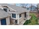 Inviting front entrance with a covered porch, bay window, manicured lawn, and a 'Welcome' sign at 464 Chiswick Cir, Highlands Ranch, CO 80126
