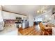 Well-lit kitchen features stainless steel appliances, granite counters, and hardwood flooring at 464 Chiswick Cir, Highlands Ranch, CO 80126
