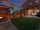 Spacious backyard with a fire pit, lounge area, and well-maintained lawn at 4125 Coriander St, Castle Rock, CO 80109