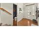 Bright entryway featuring hardwood floors, a coat closet, and a view into a half bathroom at 4125 Coriander St, Castle Rock, CO 80109