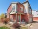 Charming two-story home boasting a cozy front porch, modern design, and landscaped surroundings at 4125 Coriander St, Castle Rock, CO 80109