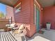 Inviting front porch area with comfortable seating, potted plants, and a welcoming ambiance at 4125 Coriander St, Castle Rock, CO 80109