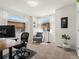 A bright office space with multiple windows, modern decor, and a cozy seating area at 4125 Coriander St, Castle Rock, CO 80109