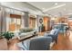 Sunlit living area with comfortable seating, hardwood floors, and an open layout to the kitchen at 4125 Coriander St, Castle Rock, CO 80109