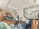 Open-concept living space with hardwood floors, recessed lighting, and stylish furnishings at 4125 Coriander St, Castle Rock, CO 80109