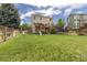 Fenced backyard featuring a play set, slide, swing, and a trampoline at 9719 Burberry Way, Highlands Ranch, CO 80129
