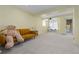 Spacious finished basement with plush carpet, projector and play area, great for entertainment and relaxation at 9719 Burberry Way, Highlands Ranch, CO 80129