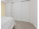 Bedroom featuring a large closet with sliding doors providing ample storage space at 9719 Burberry Way, Highlands Ranch, CO 80129