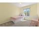 Bright bedroom with a comfortable bed and a large window offering ample natural light at 9719 Burberry Way, Highlands Ranch, CO 80129
