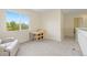 Bright room featuring a small table and chairs near a window, complemented by a comfortable armchair at 9719 Burberry Way, Highlands Ranch, CO 80129