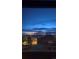 This dusk view showcases the neighboring homes with a beautiful sky, and an overall quiet atmosphere at 9719 Burberry Way, Highlands Ranch, CO 80129
