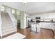 Modern kitchen with stainless steel appliances, a center island with bar stools, and white cabinetry at 9719 Burberry Way, Highlands Ranch, CO 80129
