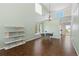 Open floor plan with hardwood floors, a breakfast nook and a view of the kitchen at 9719 Burberry Way, Highlands Ranch, CO 80129