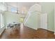 Bright Living Room with soaring ceilings, hardwood floors, and a view of the second floor at 9719 Burberry Way, Highlands Ranch, CO 80129