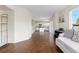 View of the living room that shows the flow into the kitchen at 9719 Burberry Way, Highlands Ranch, CO 80129