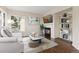 Cozy living room featuring a fireplace, stylish decor, and a comfortable seating area at 9719 Burberry Way, Highlands Ranch, CO 80129