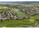 Aerial community view featuring a beautiful golf course winding around a scenic lake at 1251 Double Eagle Ct, Castle Rock, CO 80104