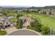 Aerial view of the home showing the property, three-car garage, and golf course community at 1251 Double Eagle Ct, Castle Rock, CO 80104