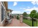 Stunning back deck with wood floors, stone pillars, a metal railing and scenic views at 1251 Double Eagle Ct, Castle Rock, CO 80104