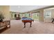 Finished basement featuring a pool table and walkout access to the yard at 1251 Double Eagle Ct, Castle Rock, CO 80104
