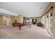 Finished basement featuring a pool table and walkout access to the yard at 1251 Double Eagle Ct, Castle Rock, CO 80104