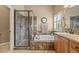 Bathroom featuring a tiled shower, soaking tub, shuttered window, and tiled flooring at 1251 Double Eagle Ct, Castle Rock, CO 80104