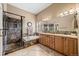 Well-lit bathroom features a glass shower, soaking tub, double vanity and tiled floors at 1251 Double Eagle Ct, Castle Rock, CO 80104