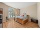 Bedroom features hardwood floors, a window, and decor at 1251 Double Eagle Ct, Castle Rock, CO 80104